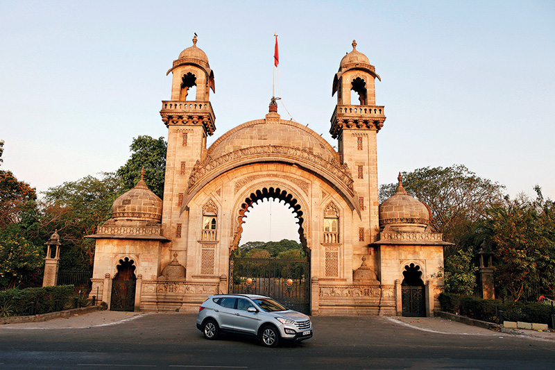 At the grand gateway to Laxmi Vilas Palace